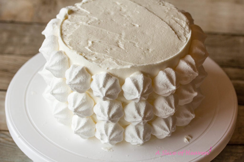 Meringues on the side of the cake